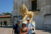 In front of lion sculpture